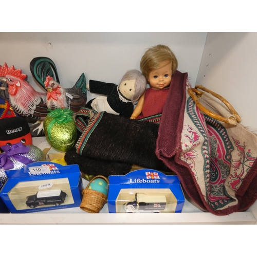 110 - Three shelves of sundries to include boxed model vehicles, games, reels of thread and ornaments, sof... 