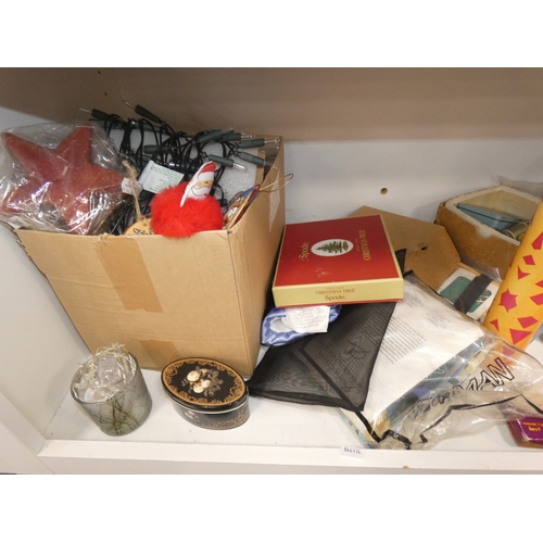 110 - Three shelves of sundries to include boxed model vehicles, games, reels of thread and ornaments, sof... 