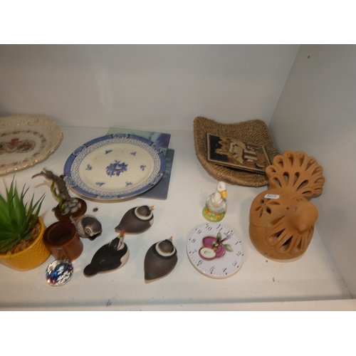 113 - Three shelves of sundries to include Panasonic 2-alarm/clock and cd player, fan heater, ornaments to... 