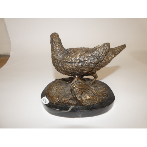 132 - Bronzed figure of a woodcock on composition marble base.