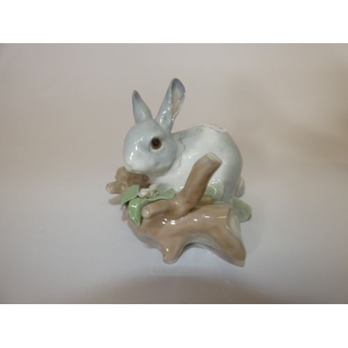 134 - Lladro figure of a Skye Terrier, and another two Lladro figure groups of a rabbit and swan group. (3... 