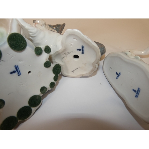 134 - Lladro figure of a Skye Terrier, and another two Lladro figure groups of a rabbit and swan group. (3... 