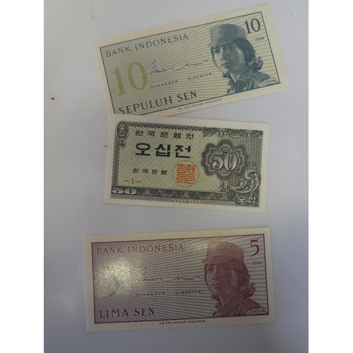 145 - Collection of world banknotes to include Japan, Indonesia, Paraguay, Chile and Bulgaria.