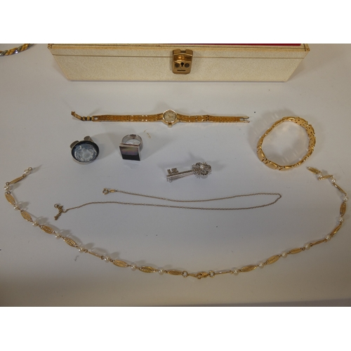 156 - Jewellery box containing costume jewellery to include chains, wristwatches and pendants etc.