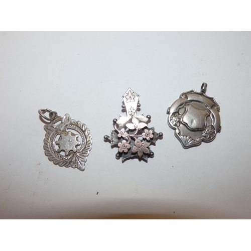 178 - Silver overlaid pendant and two silver medal fobs, 178g gross.  (3)