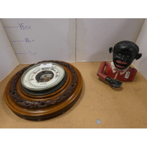 64 - Blackamoor coin bank and wall barometer, named to the dial E. Ewen, Dumfries. (2)
