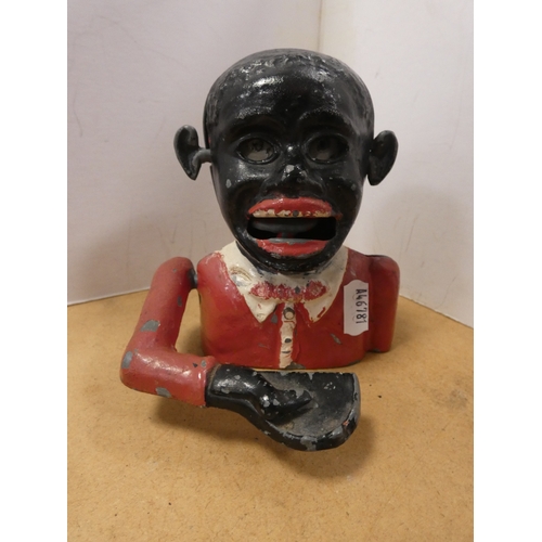 64 - Blackamoor coin bank and wall barometer, named to the dial E. Ewen, Dumfries. (2)