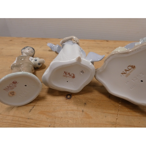 73 - Six assorted Nao figures and figurines.