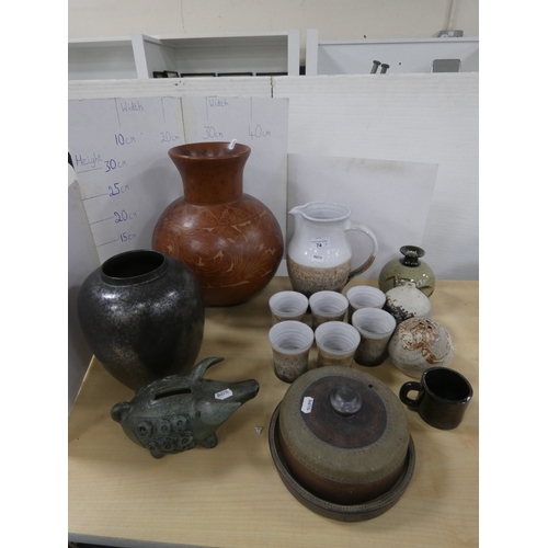 74 - Collection of studio pottery to include a water set, Tremar style bean pot with cover, coin bank in ... 