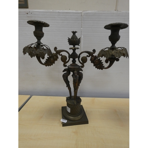 82 - French cast bronze candleabrum, decorated with flowerheads and standing griffins.
