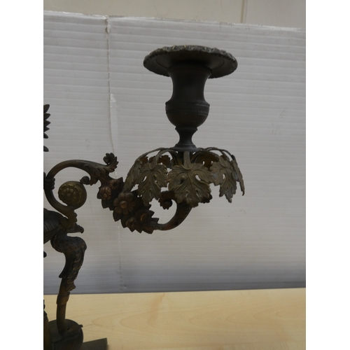 82 - French cast bronze candleabrum, decorated with flowerheads and standing griffins.
