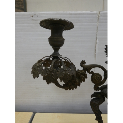 82 - French cast bronze candleabrum, decorated with flowerheads and standing griffins.