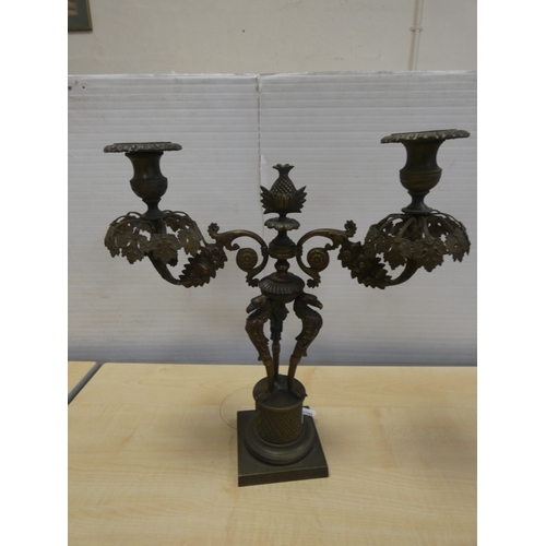 82 - French cast bronze candleabrum, decorated with flowerheads and standing griffins.