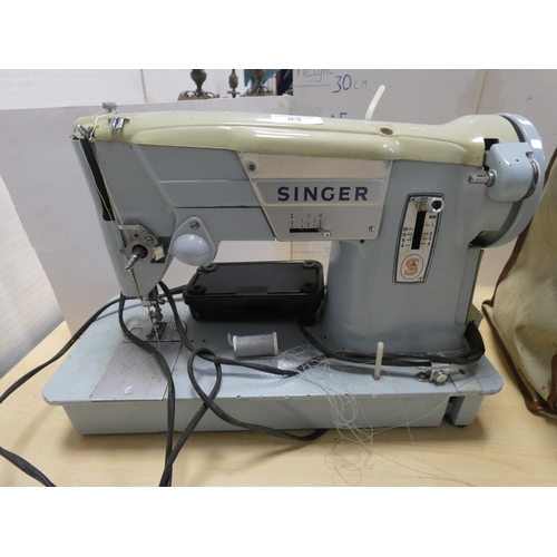 83 - Singer sewing machine.