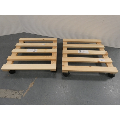 87 - Two wooden plant pot trolleys.
