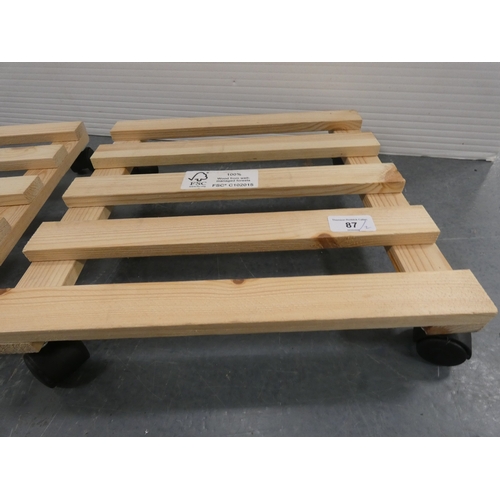 87 - Two wooden plant pot trolleys.