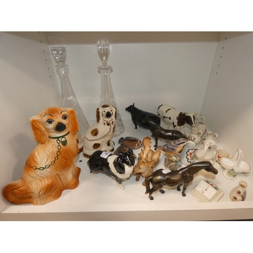 93 - Shelf lot of ceramics to include wally dugs, Beswick cows (damaged) Wade tortoise and similar, group... 