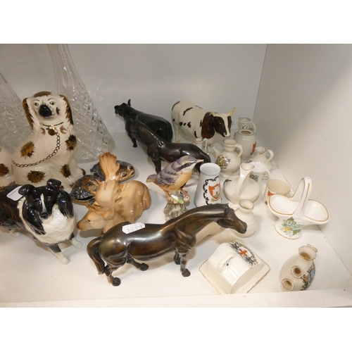 93 - Shelf lot of ceramics to include wally dugs, Beswick cows (damaged) Wade tortoise and similar, group... 