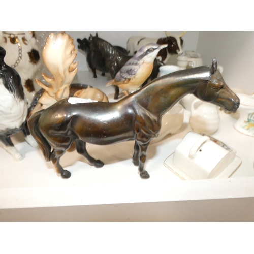 93 - Shelf lot of ceramics to include wally dugs, Beswick cows (damaged) Wade tortoise and similar, group... 