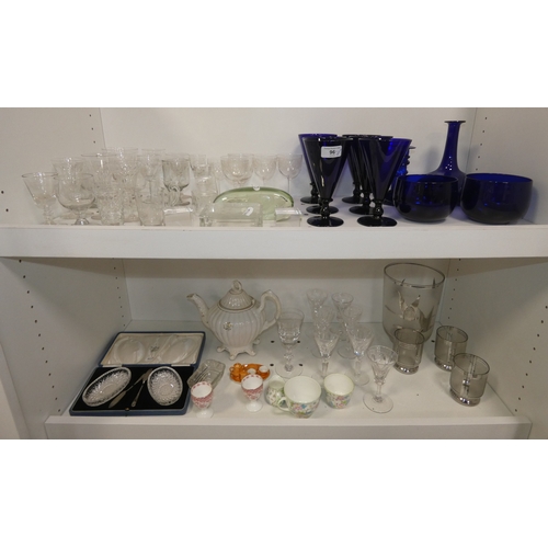 96 - Two shelves of glasses to include set of six Bristol blue coloured conical wine glasses, decanters a... 