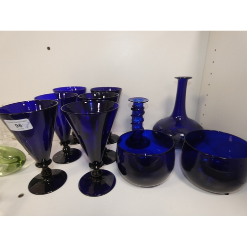 96 - Two shelves of glasses to include set of six Bristol blue coloured conical wine glasses, decanters a... 