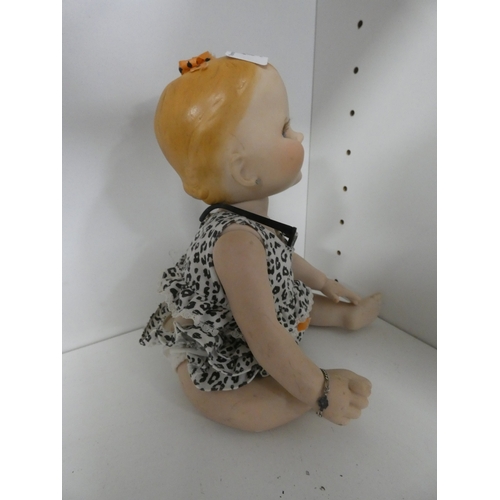 113 - Two china dolls in the form of a boy and girl, with clothing.&nbsp; (2)