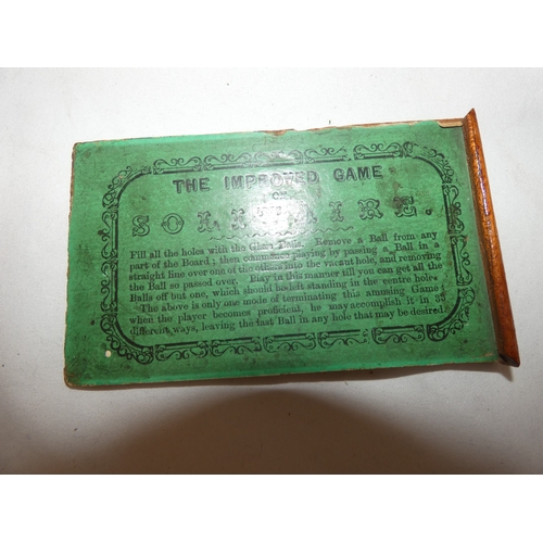 157 - Collection of antique marbles in a box, 'The Improved Game', and a related mahogany solitaire board.