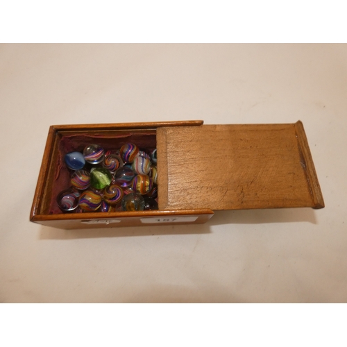 157 - Collection of antique marbles in a box, 'The Improved Game', and a related mahogany solitaire board.