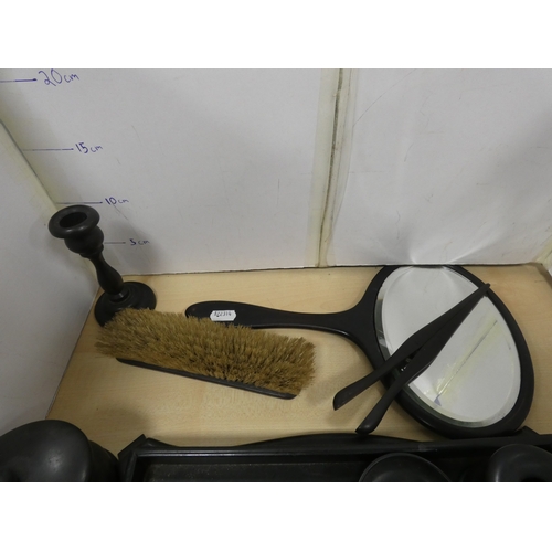 22 - Group of ebonised dressing items to include tray, mirror, box etc.