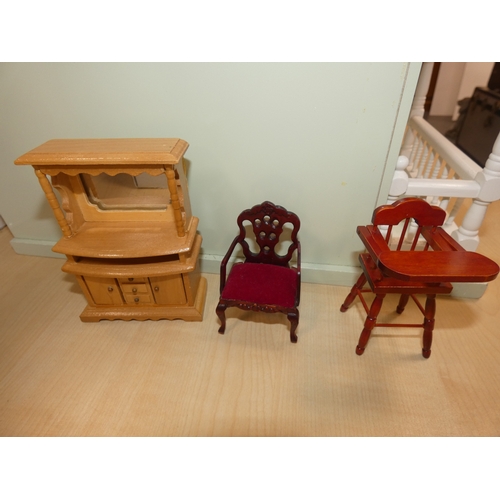 24 - Dolls house and a quantity of dolls furniture.