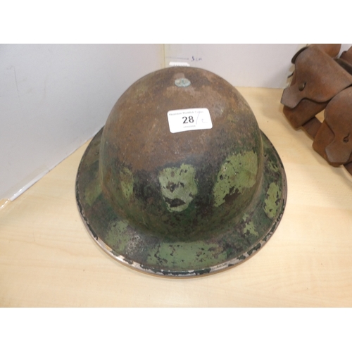 28 - WWII style military helmet, and ammunition belt. (2)
