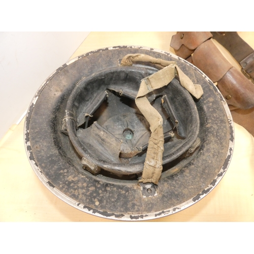 28 - WWII style military helmet, and ammunition belt. (2)
