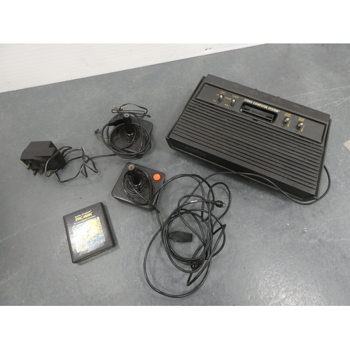 44 - Atari 2600 game console with accessories in original box.