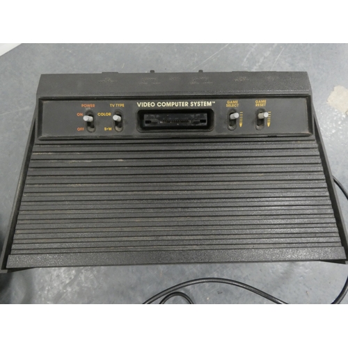 44 - Atari 2600 game console with accessories in original box.