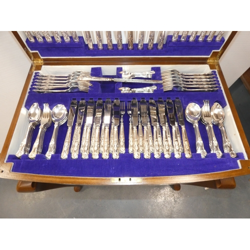47 - Viners twelve place canteen of cutlery, contained in a walnut table.
