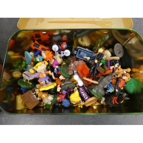 62 - Collection of assorted toy figures in a tin, and domed collectors box with fitted interior.