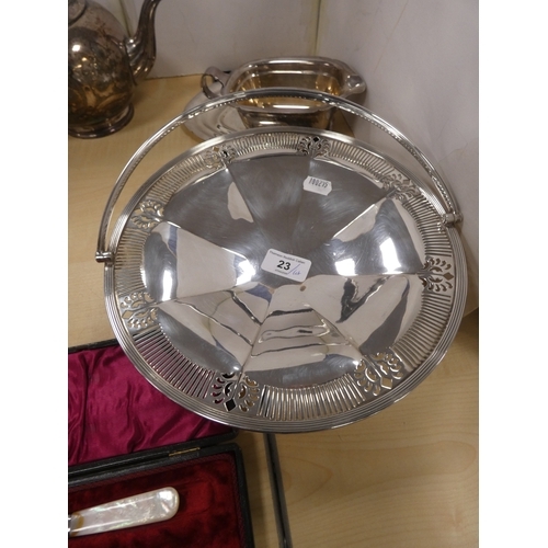 23 - Group of EP and silver plated wares to include sugar sifter, tea pot, ladle, basket, pair of mother ... 