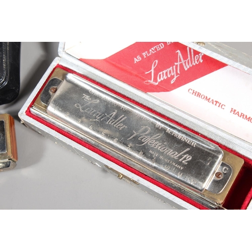 11 - Hohner The Chromonica chromatic harmonica and The Lady Adler Professional 12, boxed. (2)