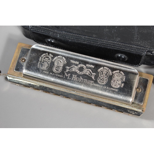 11 - Hohner The Chromonica chromatic harmonica and The Lady Adler Professional 12, boxed. (2)