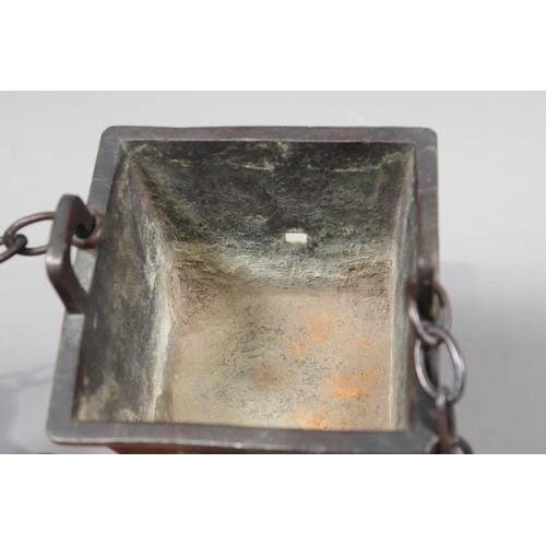 16 - Chinese bronze censer raised on four elephant supports, 14cm tall.