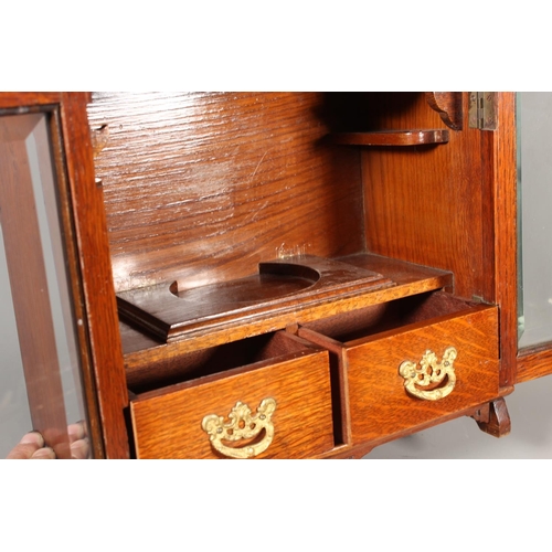 22 - Oak cased two door smokers cabinet, 33cm tall.&nbsp;