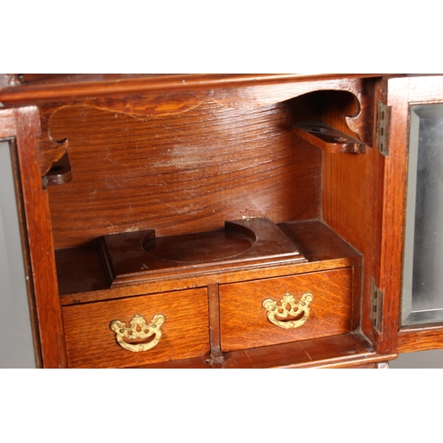 22 - Oak cased two door smokers cabinet, 33cm tall.&nbsp;