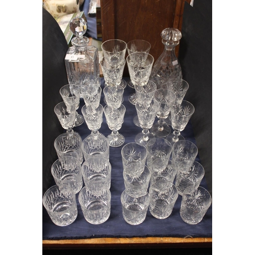 41 - Glassware to include a set of six Edinburgh Crystal whisky tumblers, two decanters, wine glasses etc... 