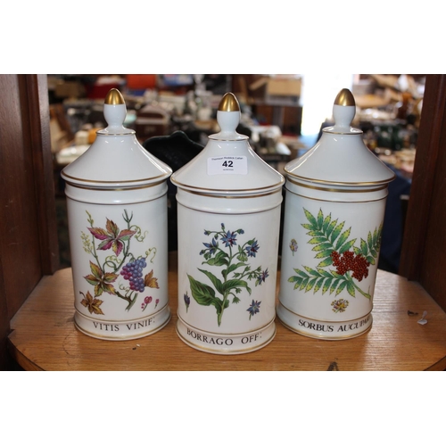42 - Three Limoges Warin pattern apothecary chemists jars and covers, 26cm tall. (3)