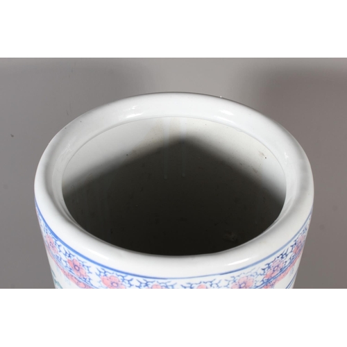 49 - Modern Oriental column stick stand, 46cm tall.&nbsp;