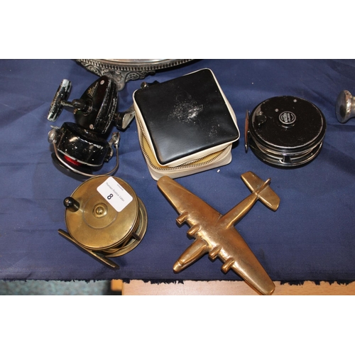 8 - Brass desktop model of an aeroplane, brass fishing reel and two others. (4)