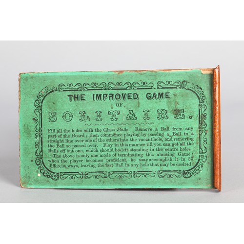 157 - Collection of antique marbles in a box, 'The Improved Game', and a related mahogany solitaire board.