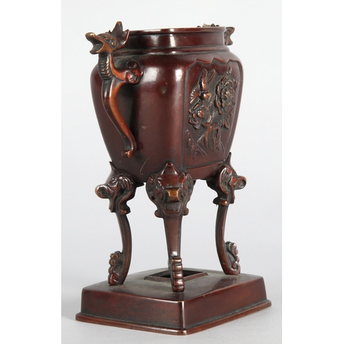 41 - Oriental raised bronzed censor with animal head motifs, 18cm h.