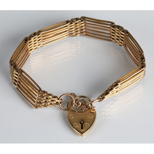 48 - Ladies unmarked yellow metal gate link bracelet with heart locket, gross weight 25.2g.