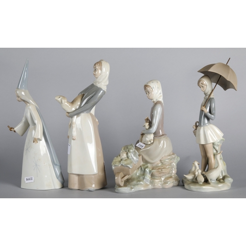 5 - Four Lladro figures to include two girl with lamb figures, 'Fairy Godmother', and 'Girl with geese' ... 
